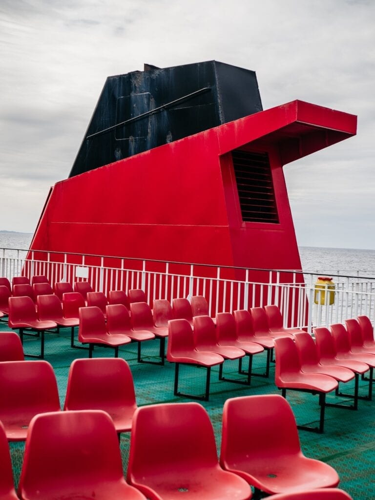 Chimney of a red ship with empty seats