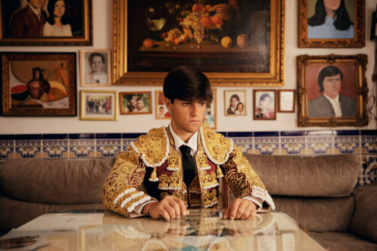 David Fuentes, sits at his grandfather's home in Montoro, he is surrounded by his grandfather's paintings. David is from a famil of bullfighters. 10th March 2023. Photo by Owen Harvey