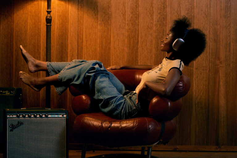 © Owen Harvey, Miles Ahead - Abeena listens back to a studio recording through headphones